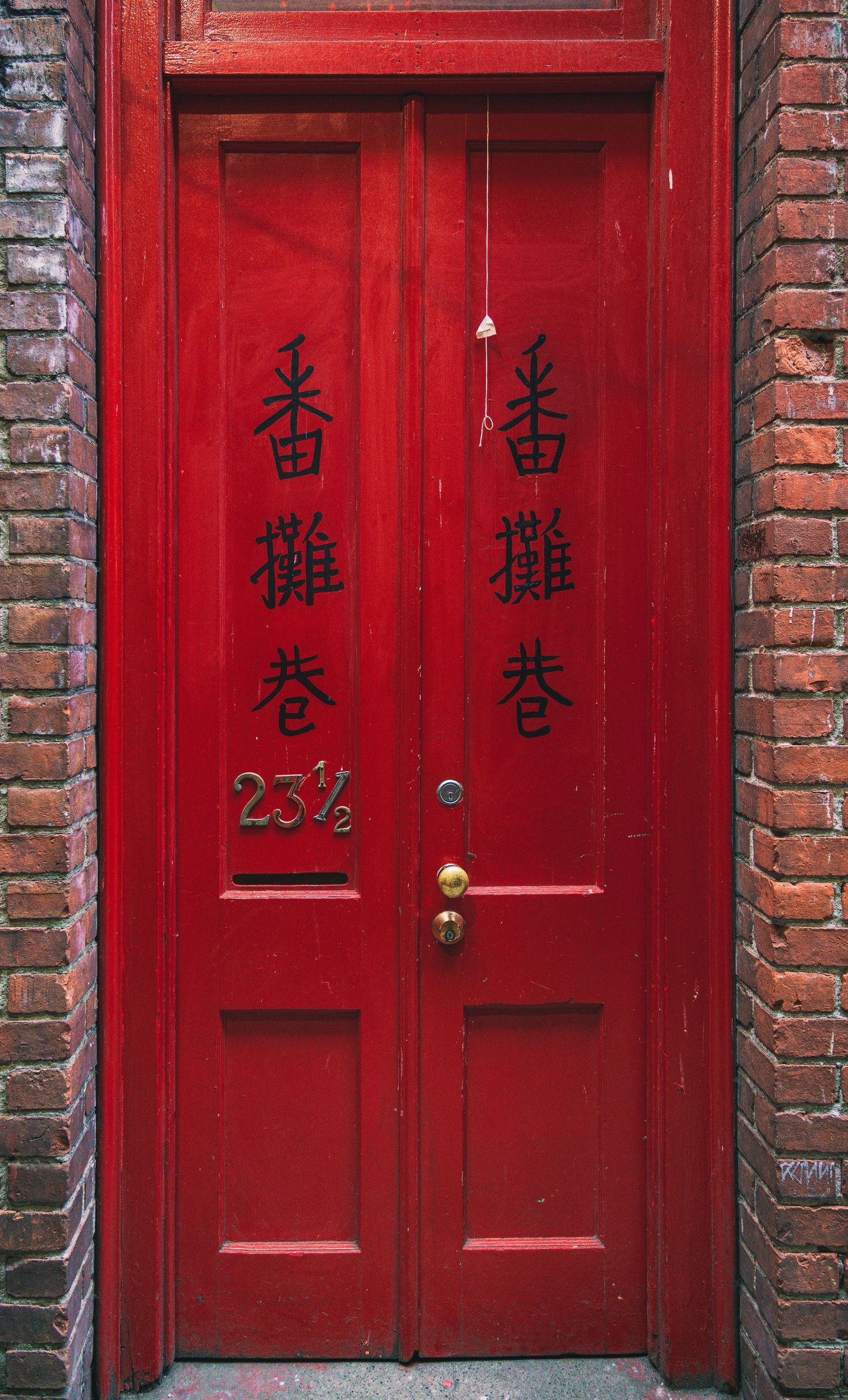 Red chinese door in the Fan Tan Alley during the Awakening Chinatown Festival