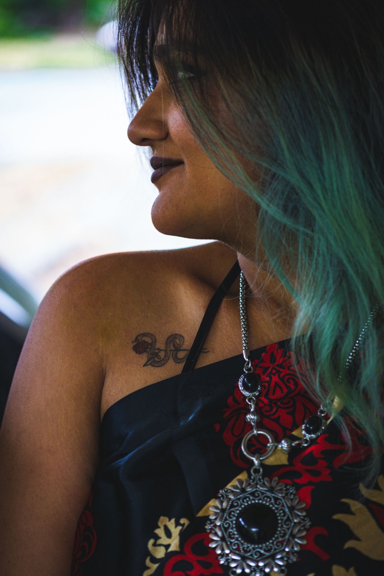 Close-up of Indian woman in red sari, showcasing traditional jewellery in Victoria, Canada