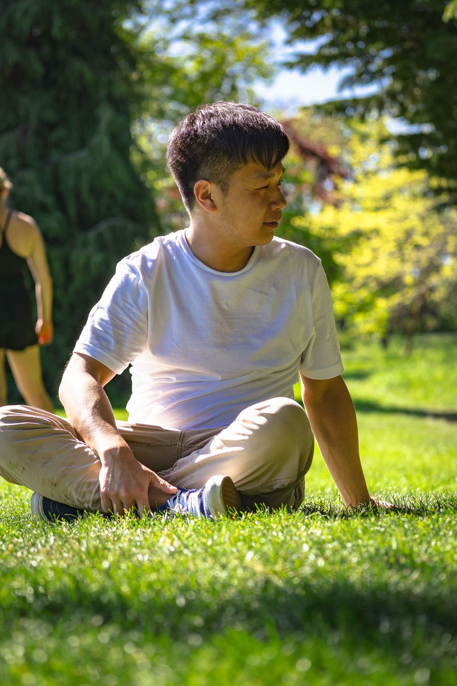 Natural portrait of a guy conversing around in the park