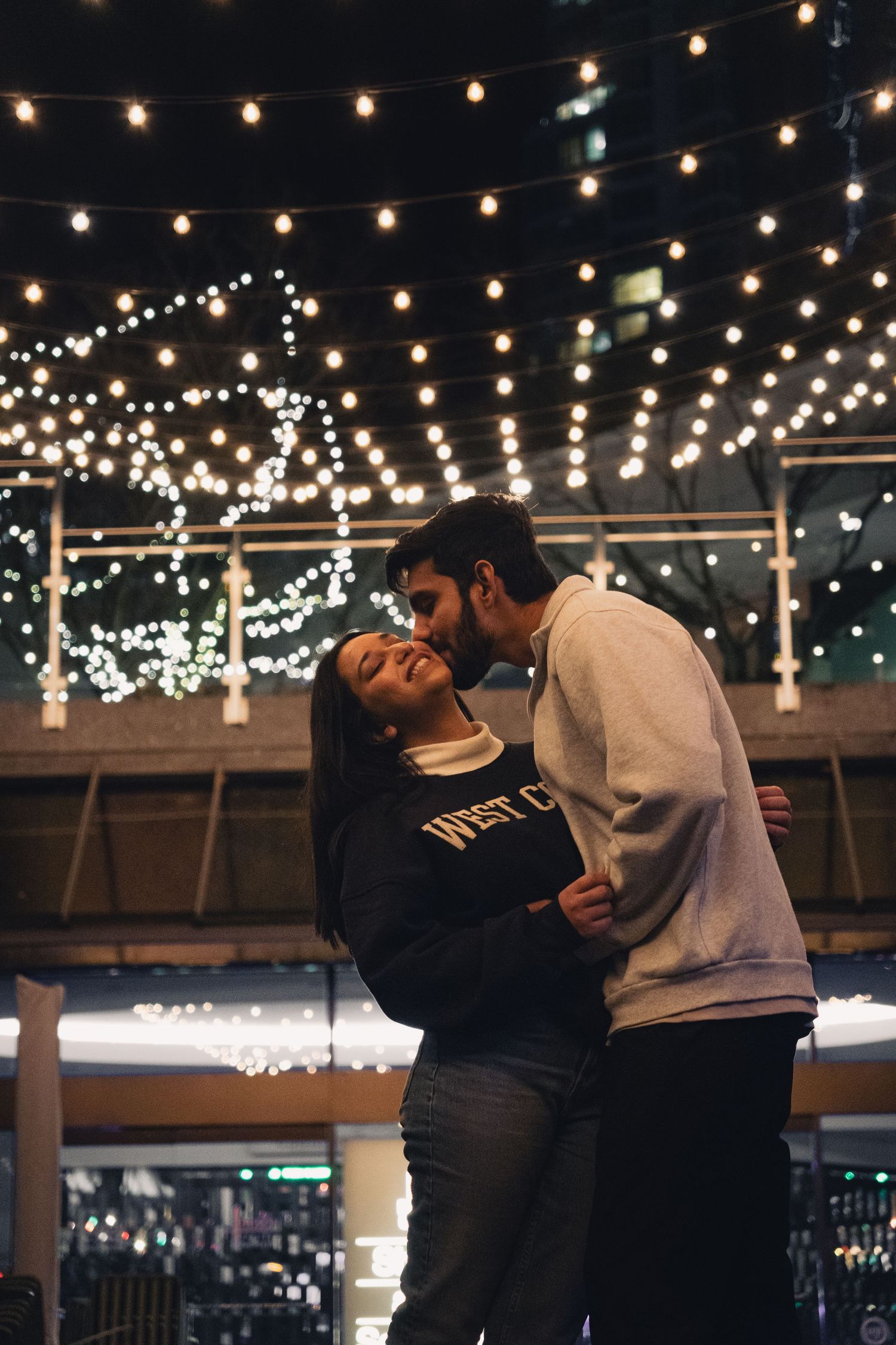 Love under the soft glow of alley lights at night - Couples shoot in Vancouver, Canada