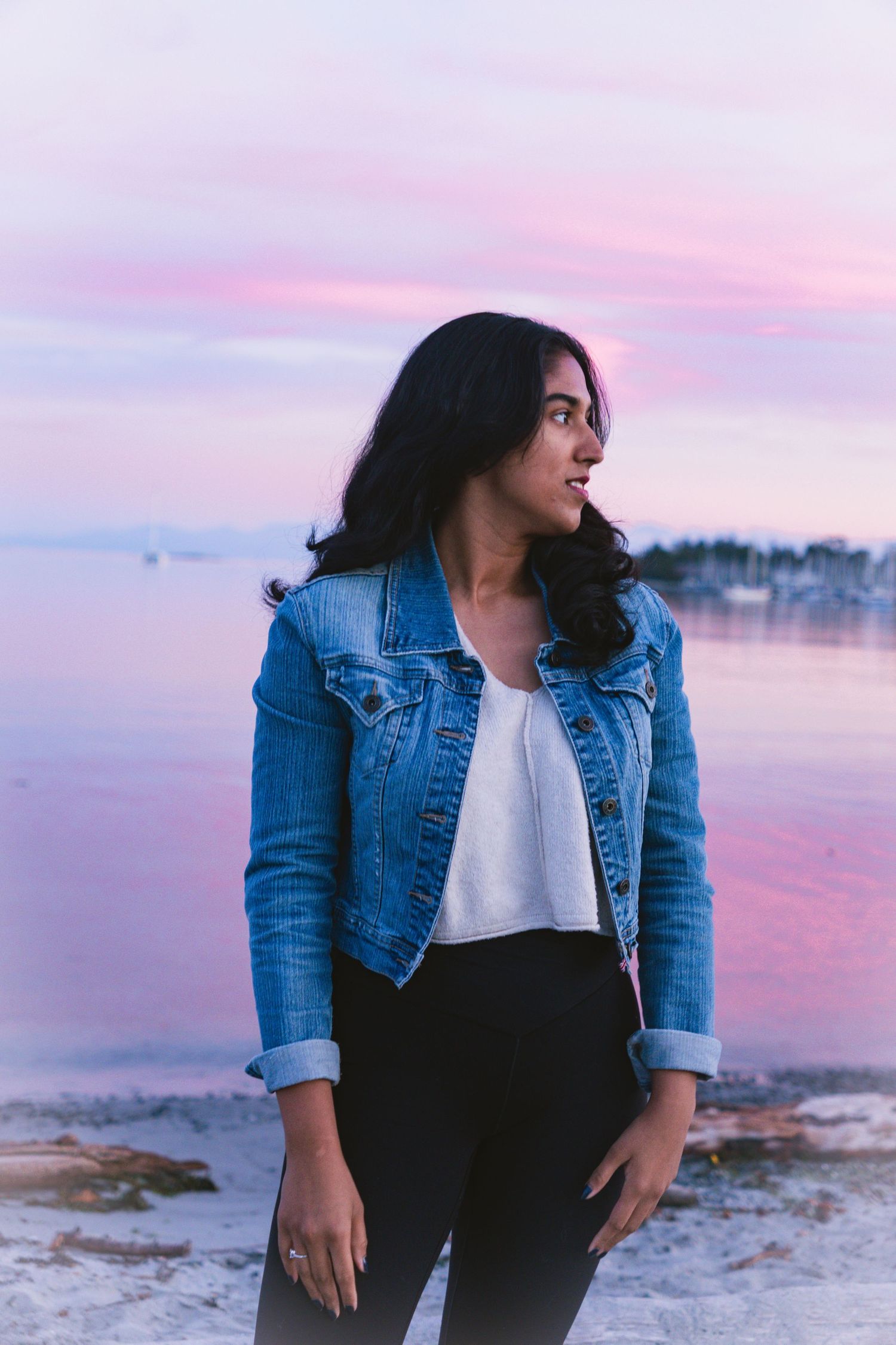 Pink evening light close-up of a women posing during sunset shoot in Cadboro-Gyro park in Victoria