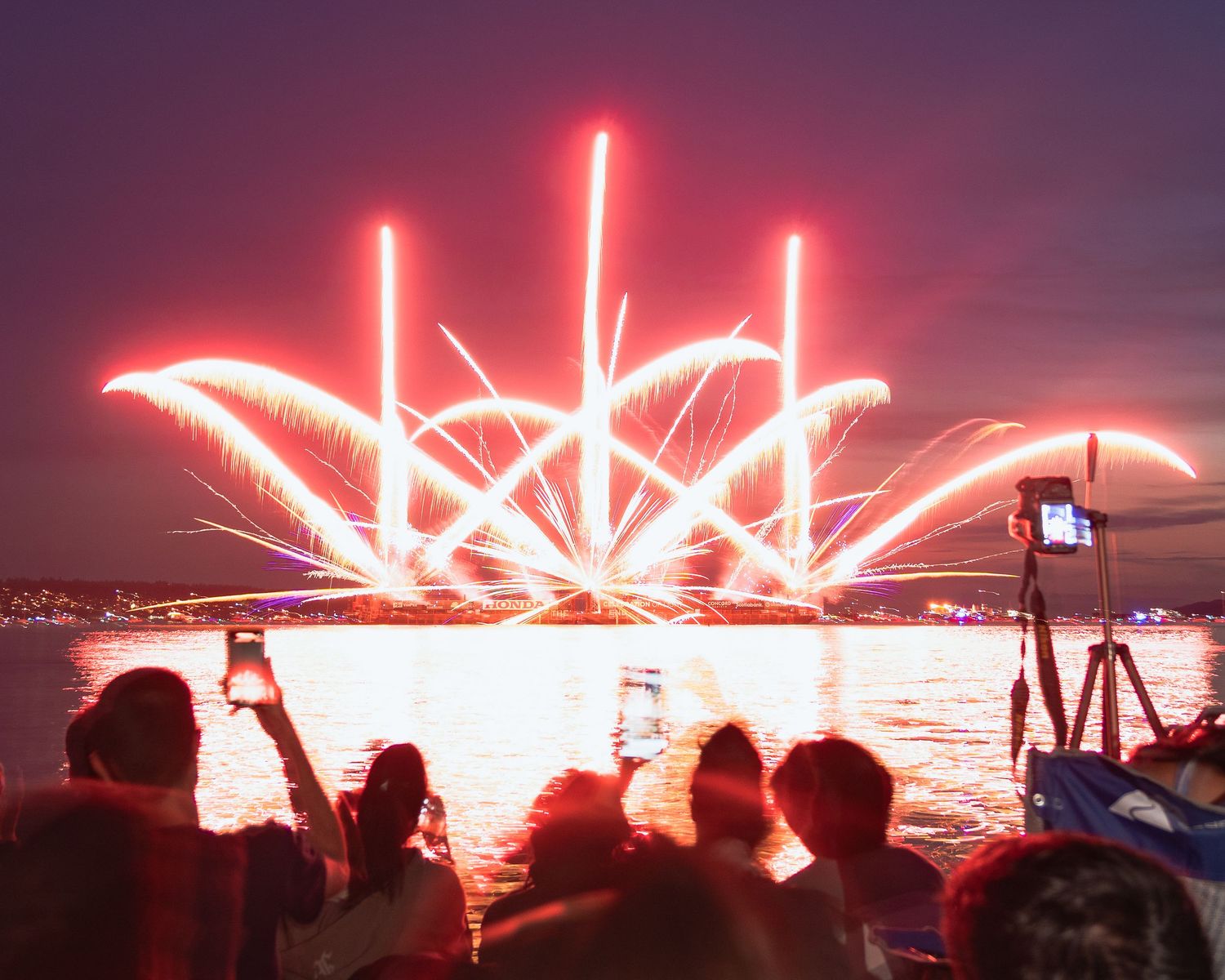 Fiery spark trails soaring above English Bay at Vancouver’s fireworks festival