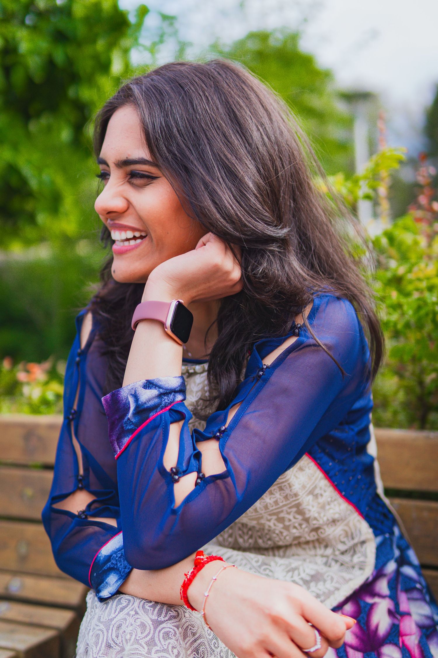 Natural laugh of a women in the evening light in Graduation setting of University of Victoria, Canada