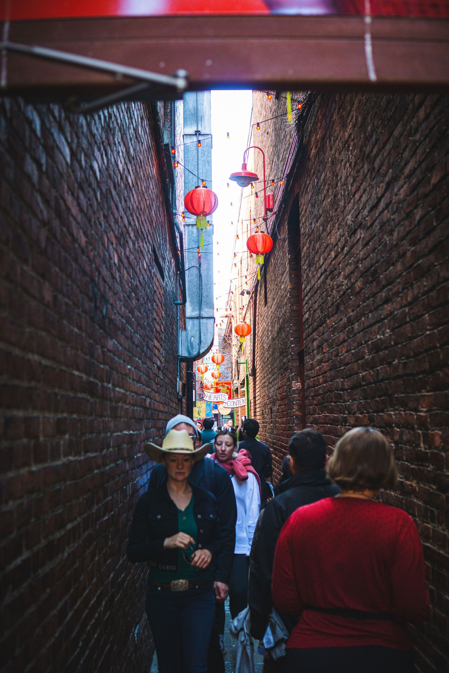 Street filled with festival-goers enjoying Awakening Chinatown celebration - Fan Tan Alley