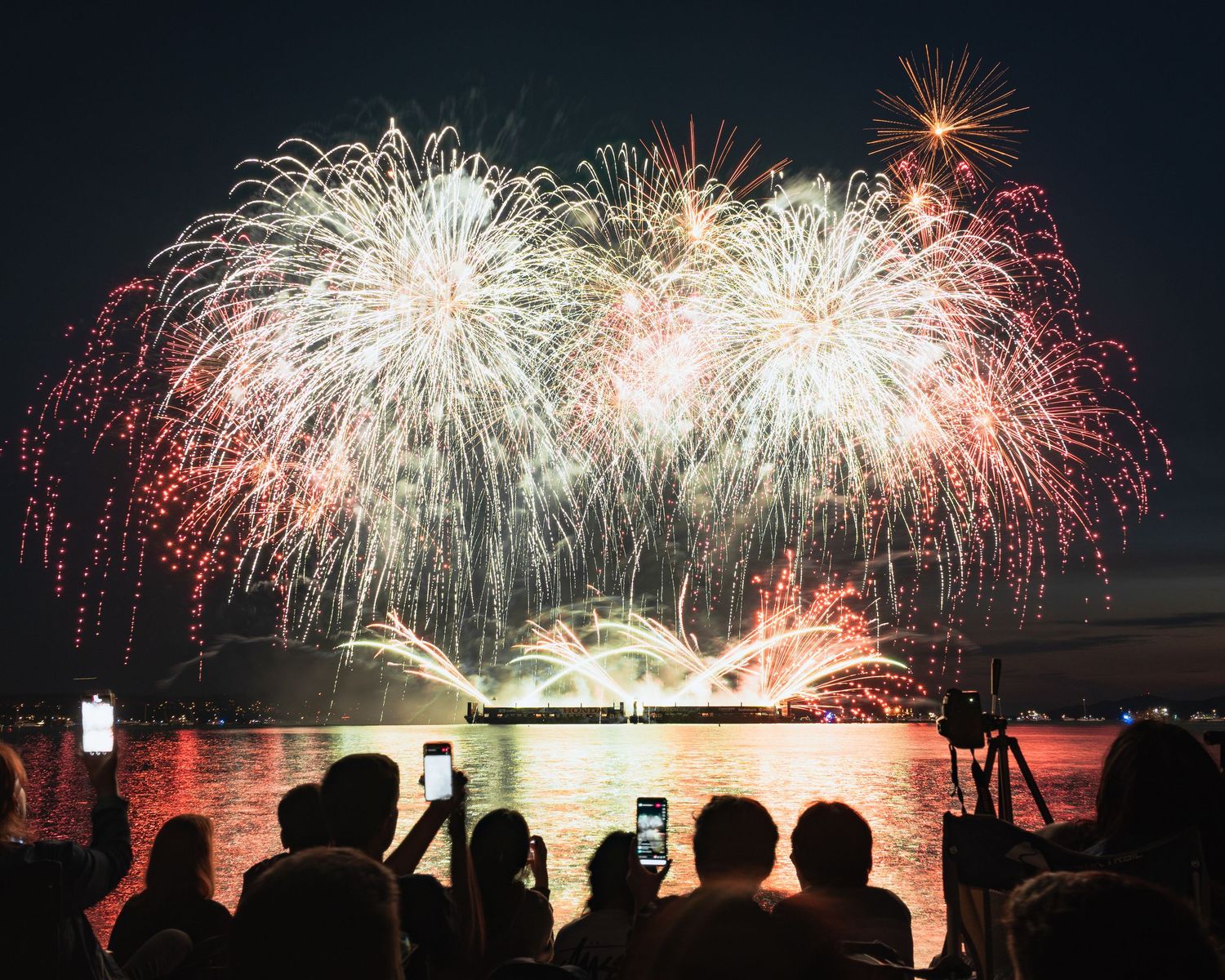 Massive firework explosion over the dark horizon at Vancouver’s English Bay