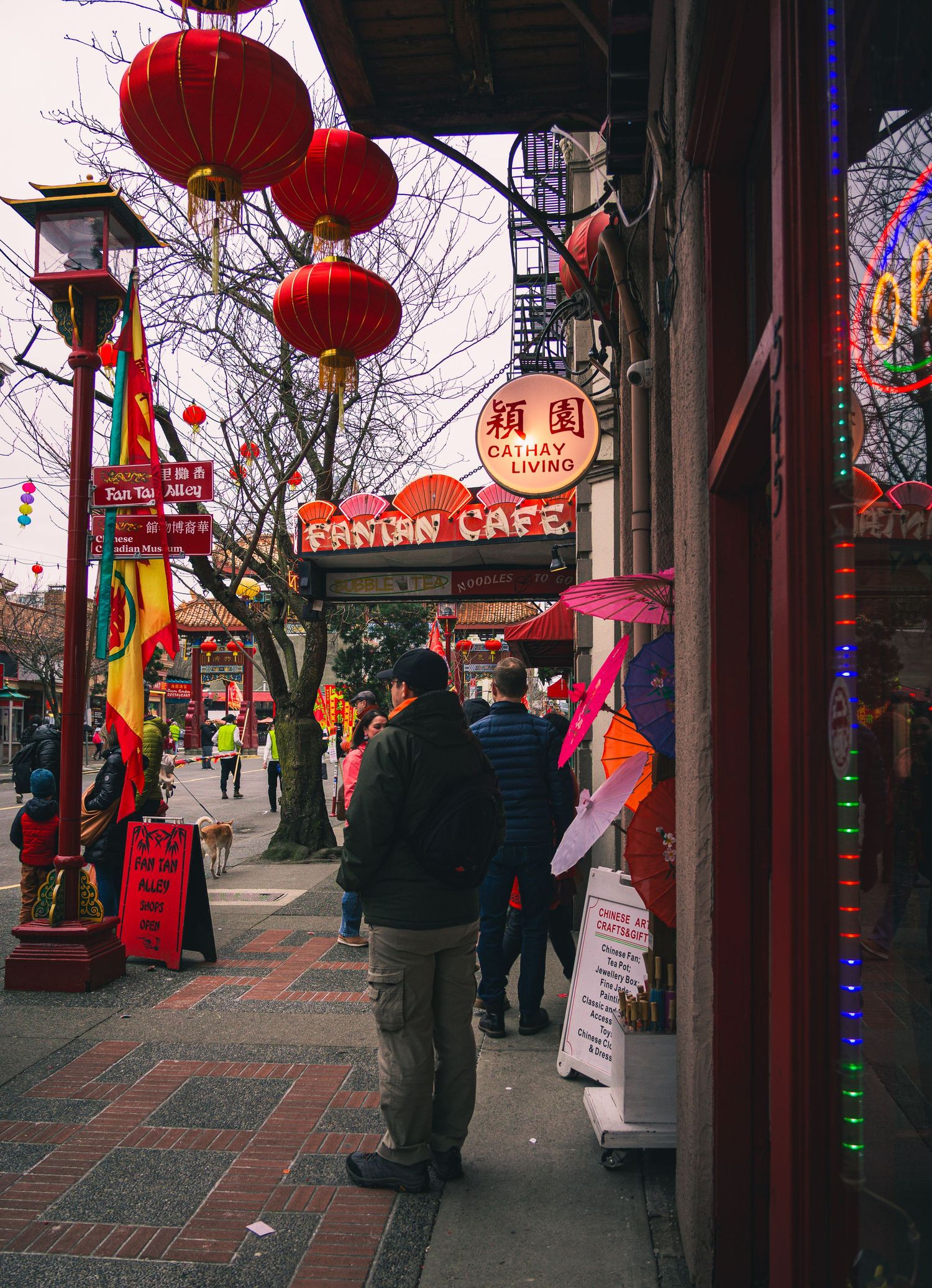 Street filled with festival-goers enjoying Awakening Chinatown celebration
