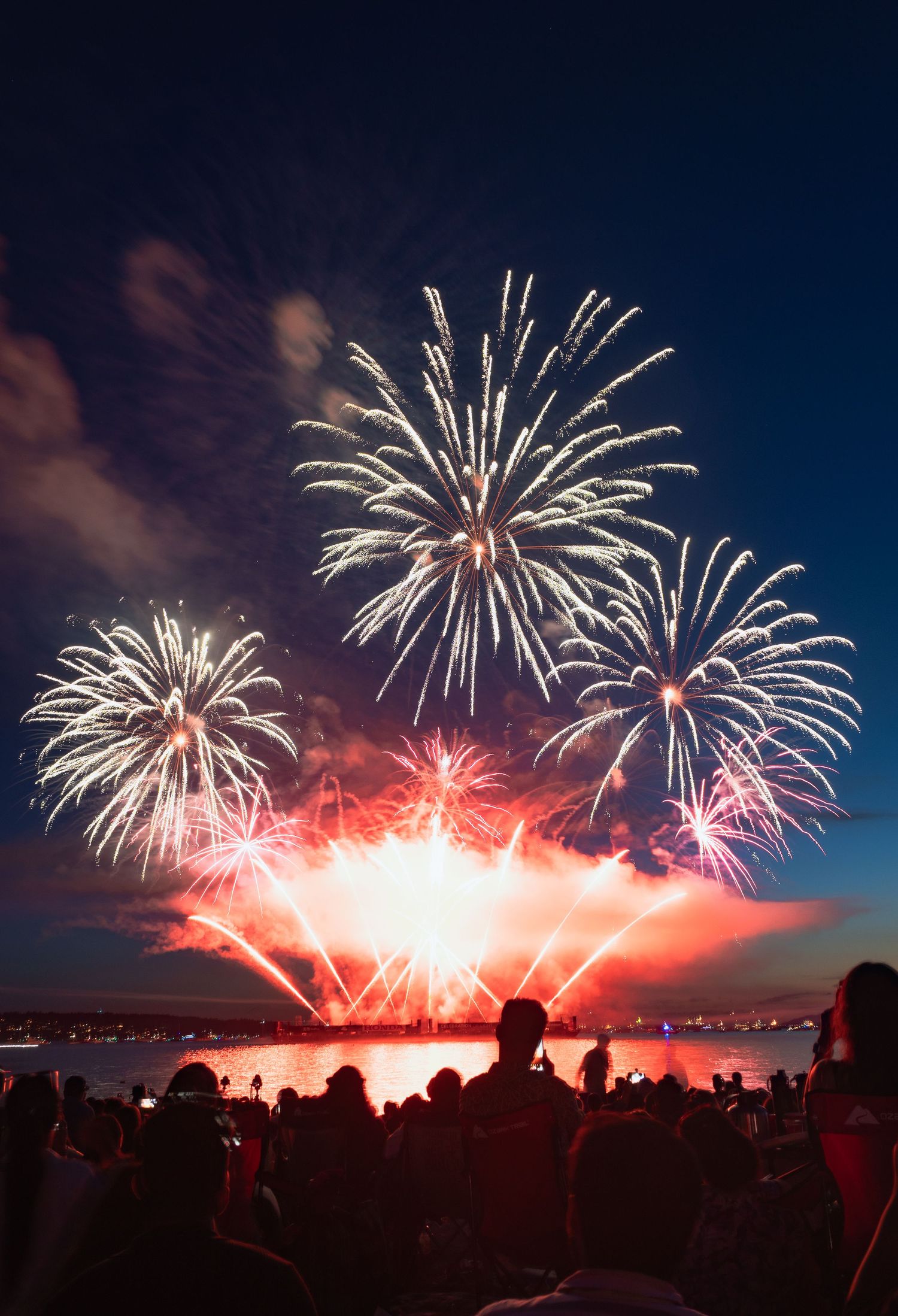 Fiery spark trails soaring above English Bay at Vancouver’s fireworks festival