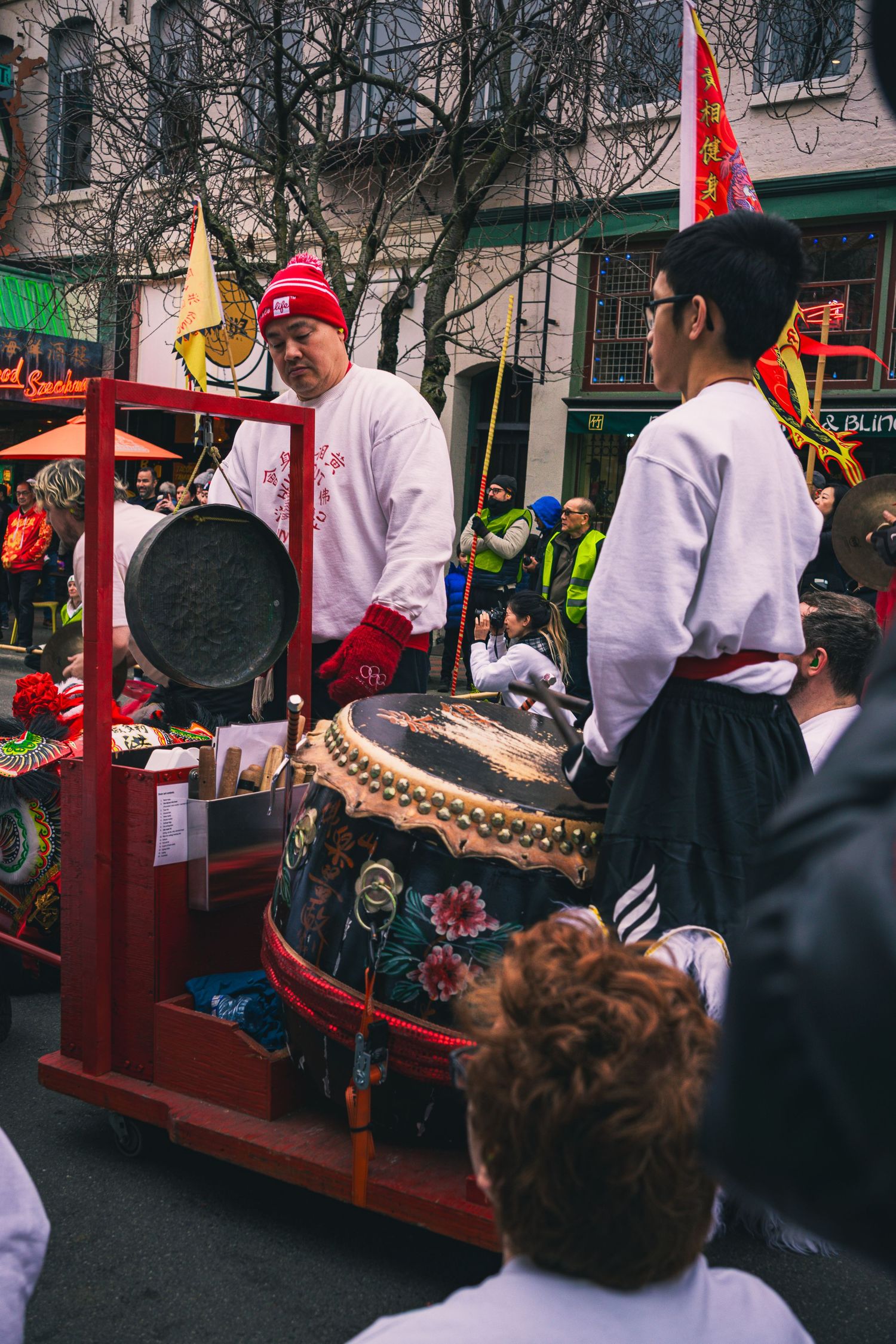 Drummers playing lively beats during lion dance ceremony