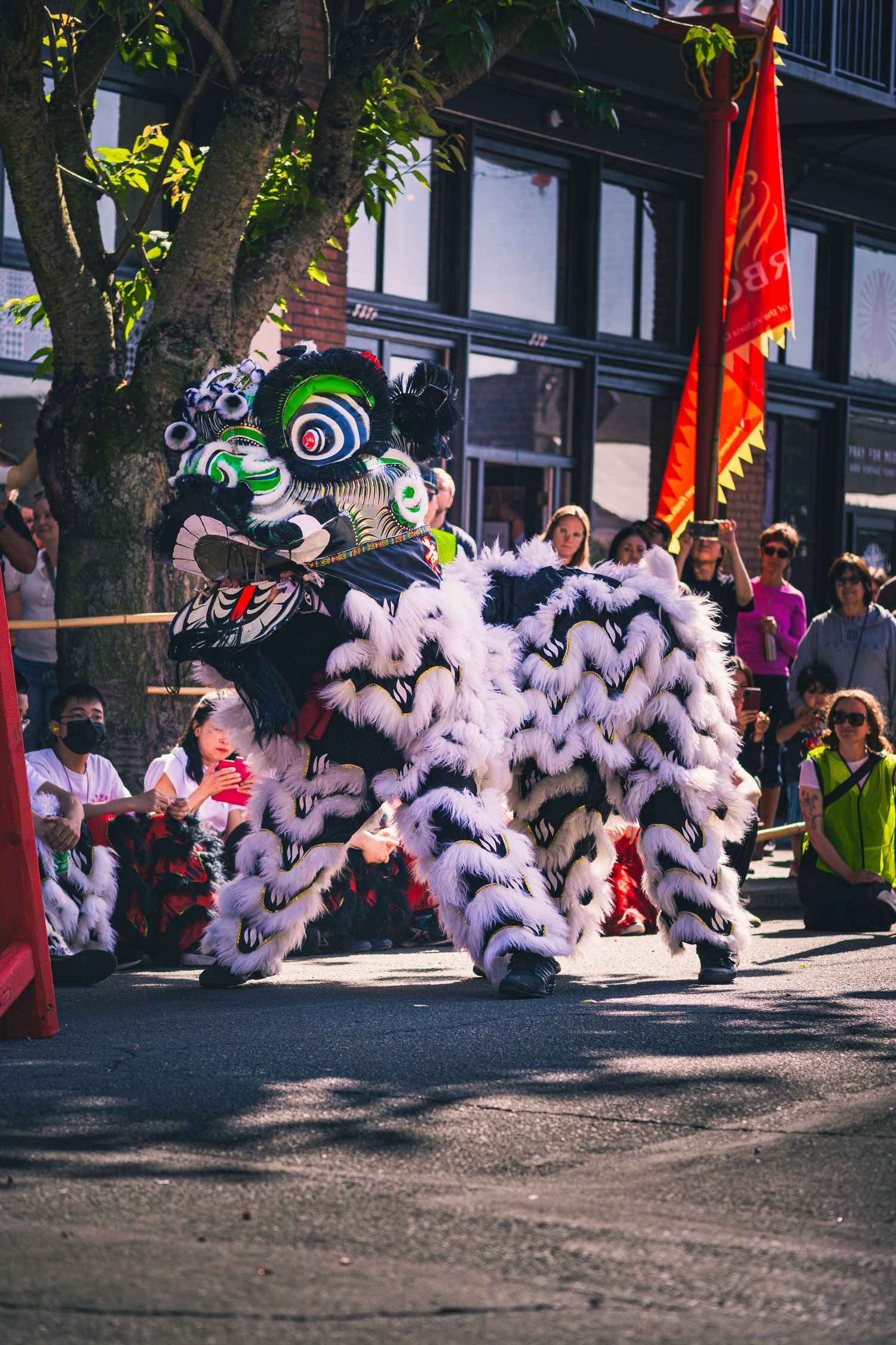 Wide view of historic Chinatown filled with cultural displays