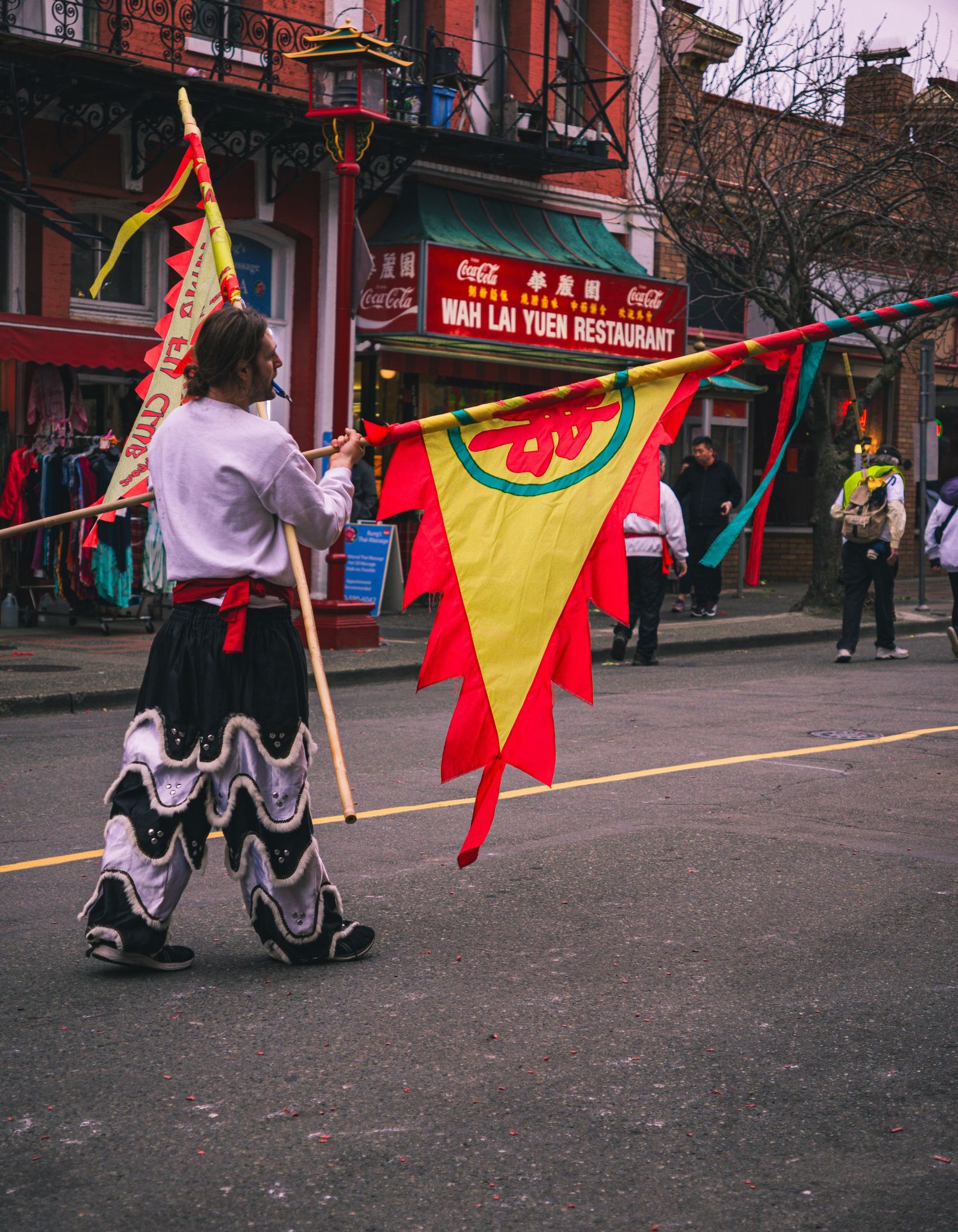 Performer preparing for lion dance at Chinatown event in British Columbia