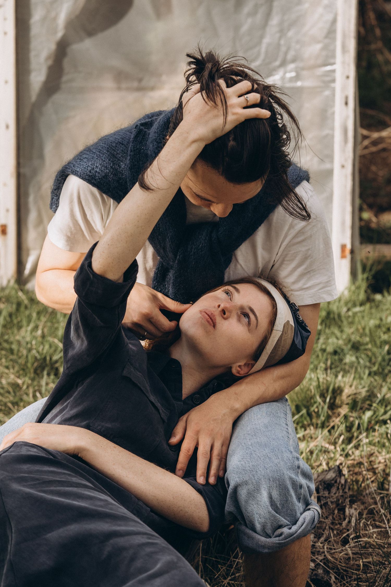 Intimate candid moments captured in black and white outdoor setting.