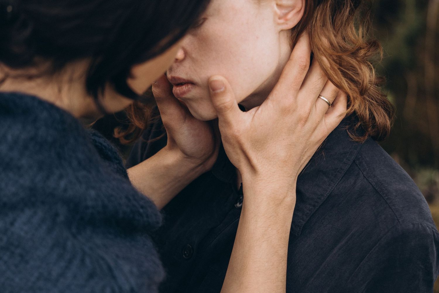 Close-up shots of tender moments between two people outdoors.