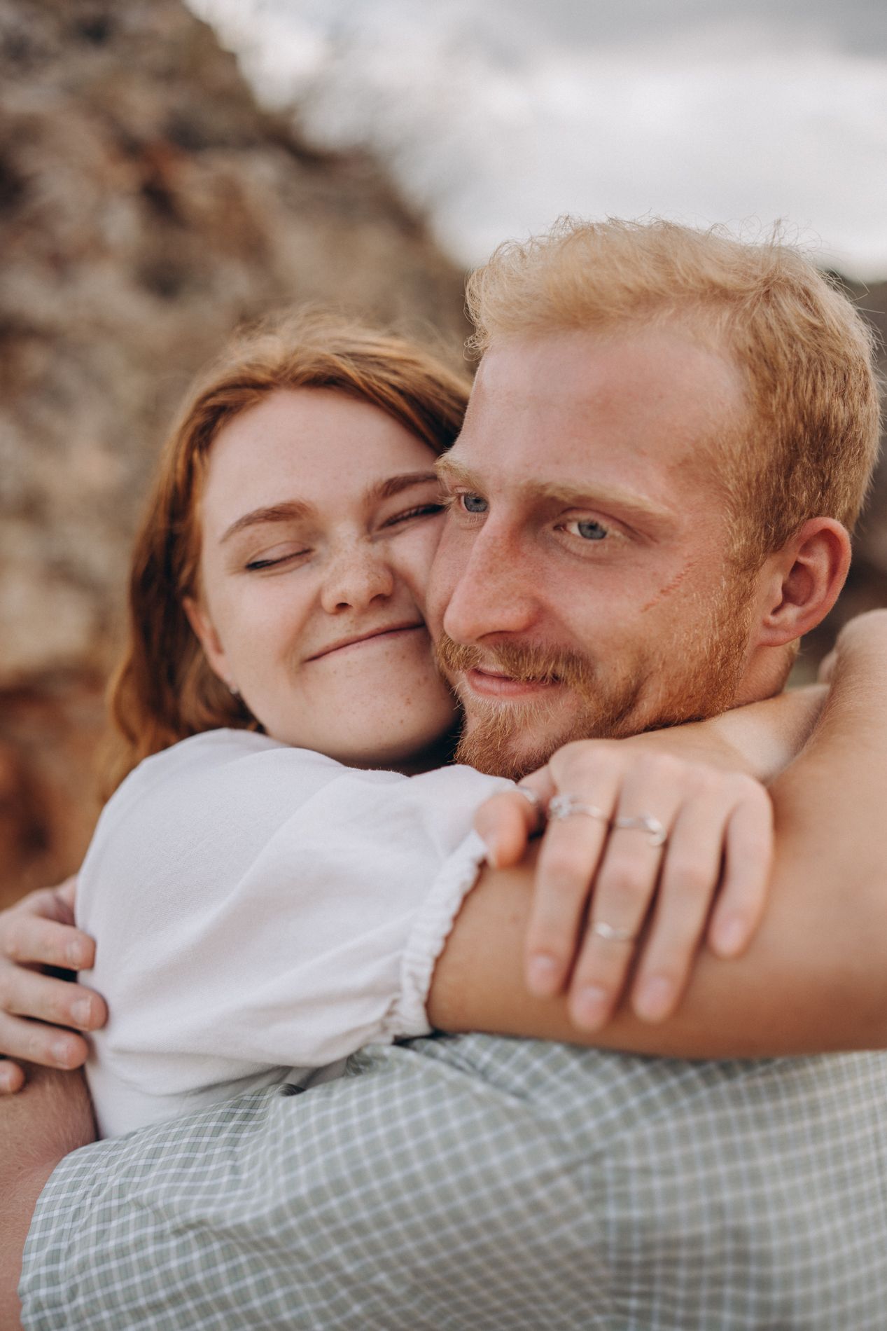 A series of tender moments captured in warm tones showing affectionate embraces and gentle kisses.