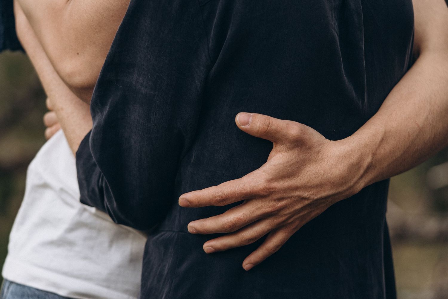 Intimate close-up shots showing gentle hand gestures and emotional connection.