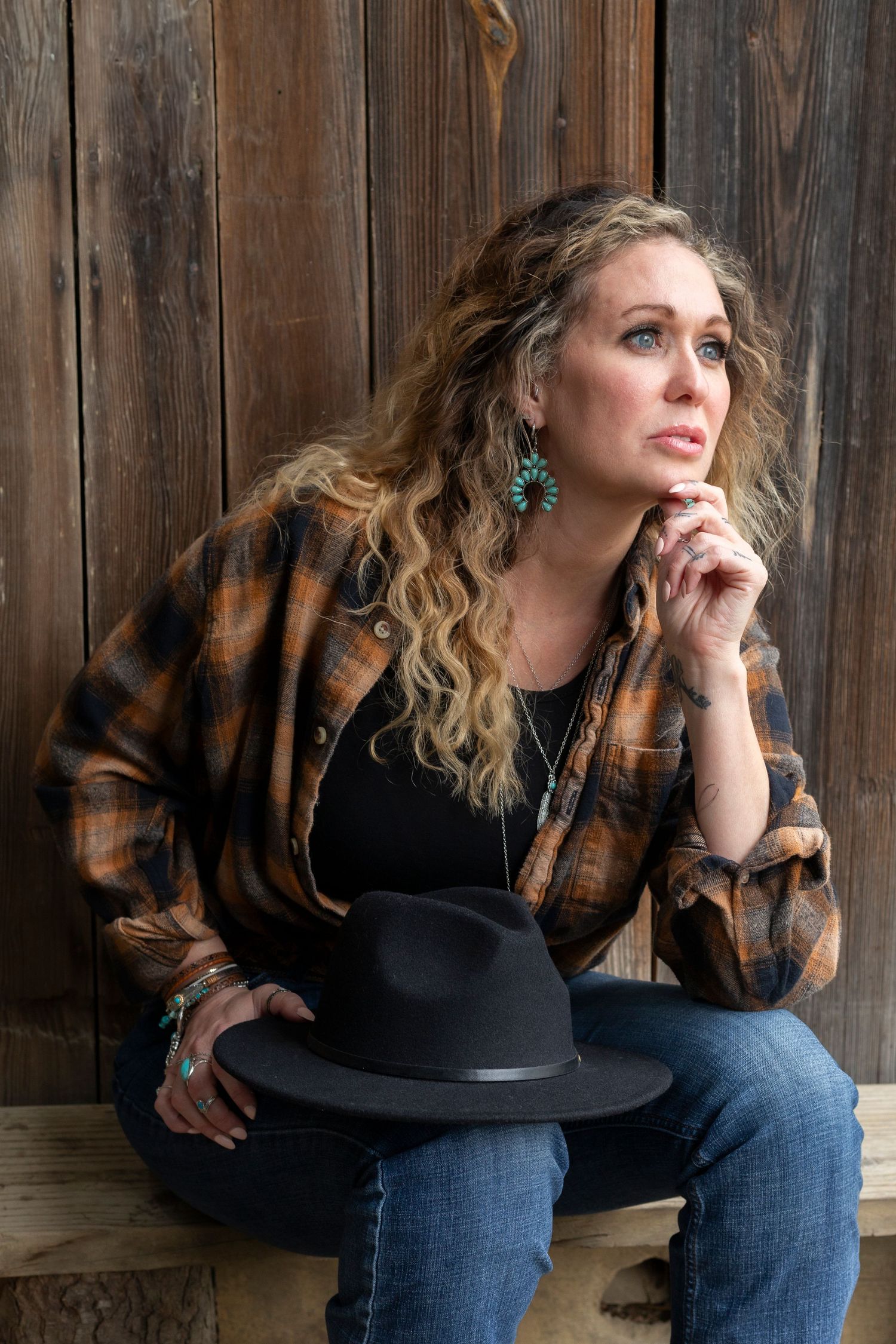 Artistic portrait series with person in plaid and denim against rustic wooden backdrop.