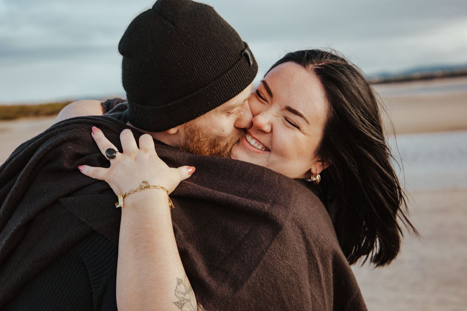 Windswept hair and a romantic kiss on the beaches of Labrador.