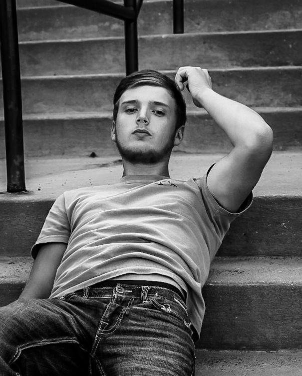 Black and white artistic photo sequence showing a person lying on concrete steps in different poses.