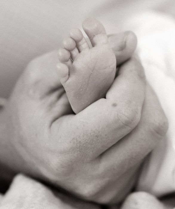 Black and white artistic sequence of sleeping baby's face in close-up profile views.