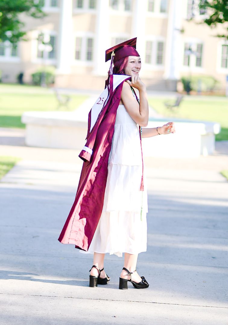 A series of flowing white dress photos with burgundy graduation gown details in an outdoor setting.