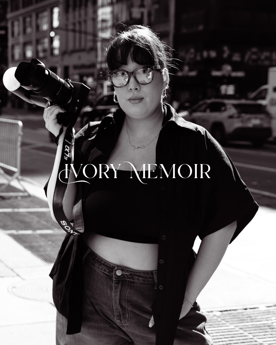 Black and white photo of a woman holding a camera on her shoulder on a city street, with Ivory Memoir text overlay.