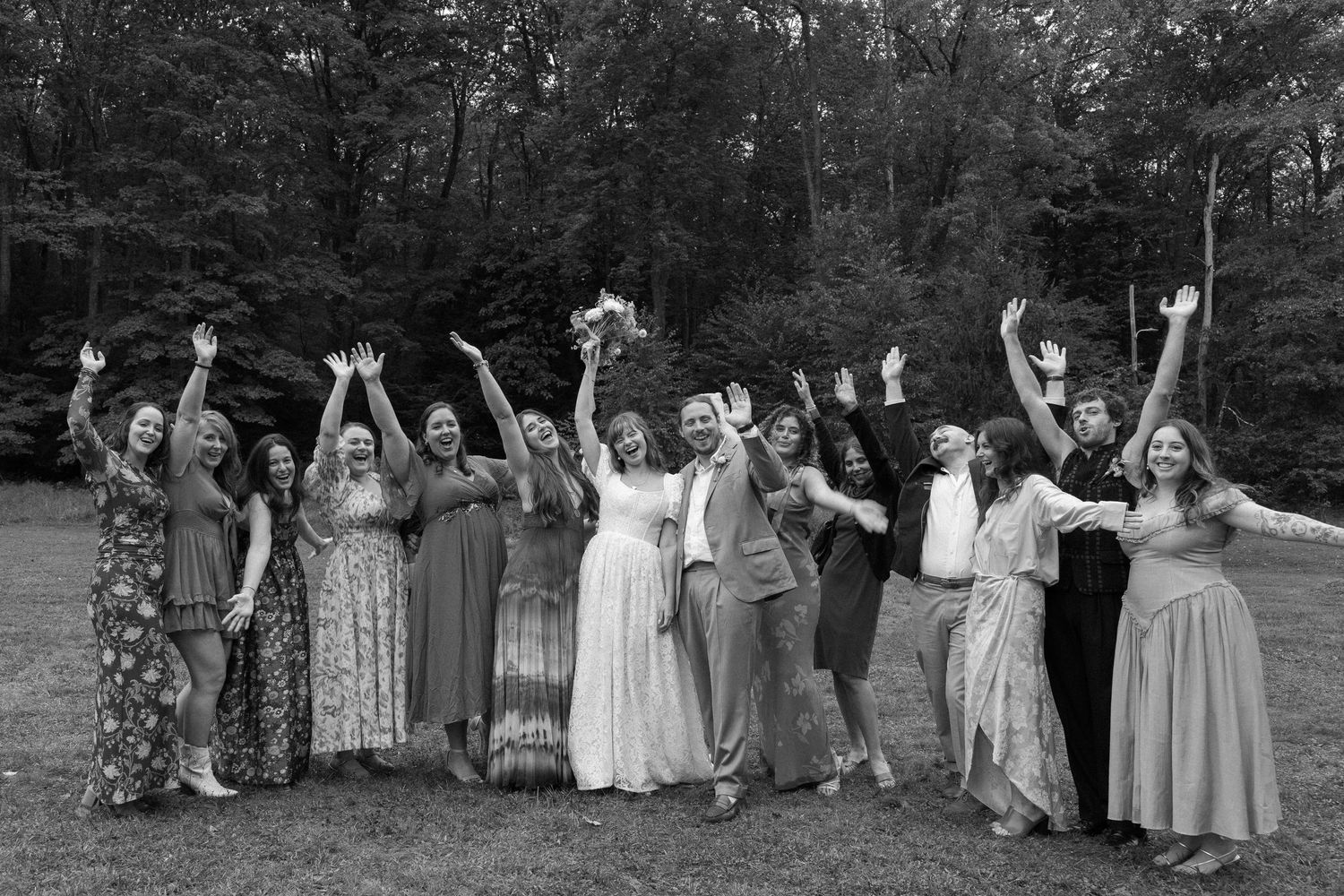 A group in formal attire poses joyfully together outdoors in a series of black and white celebration photos.