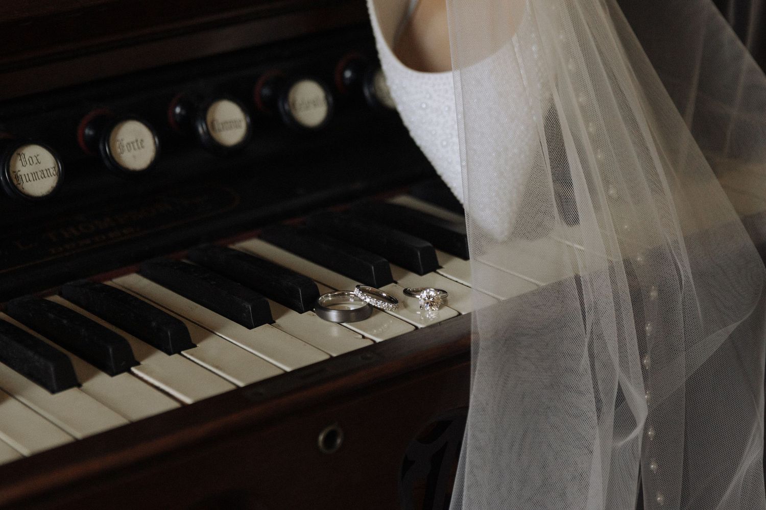 Extreme closeup shots of piano keys and sheet music in black and white artistic lighting.