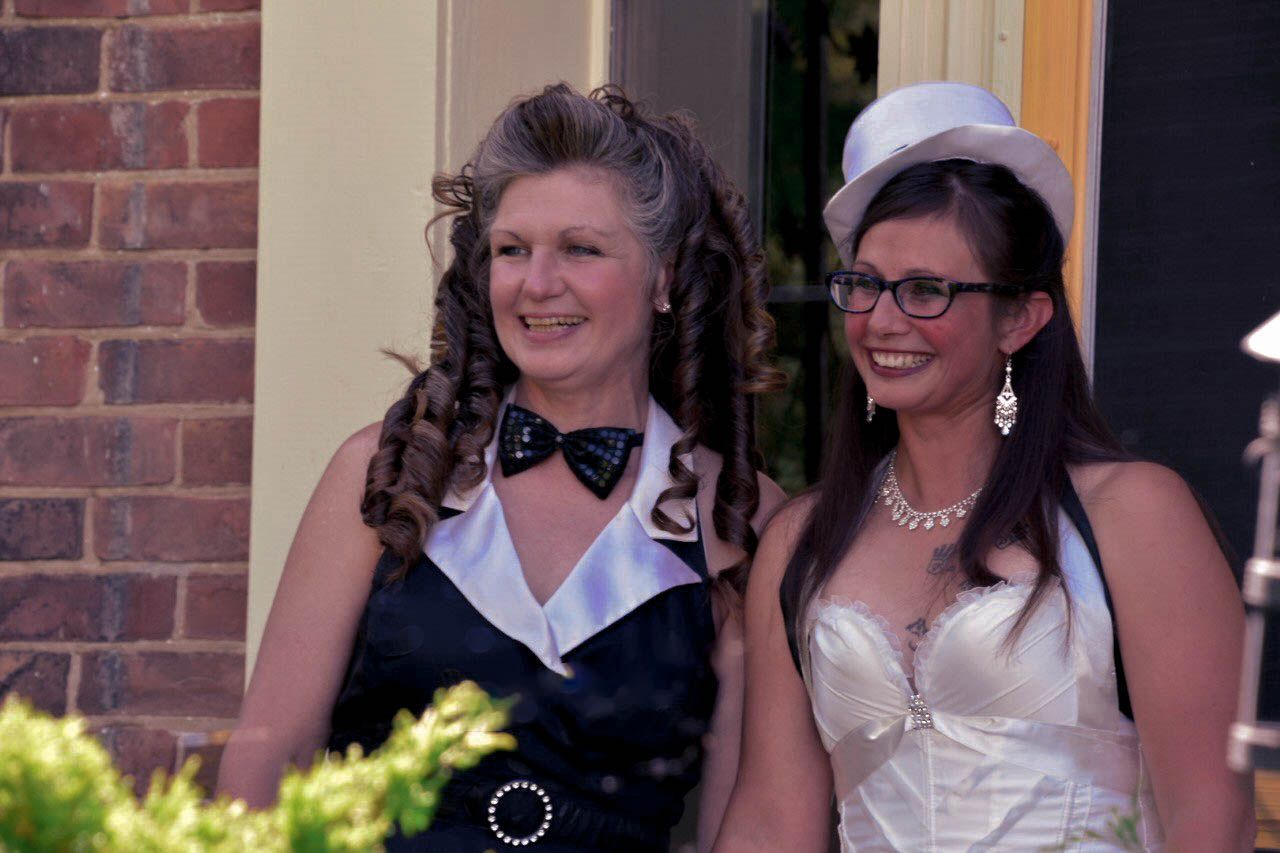 Bride and her mother smiling before the ceremony