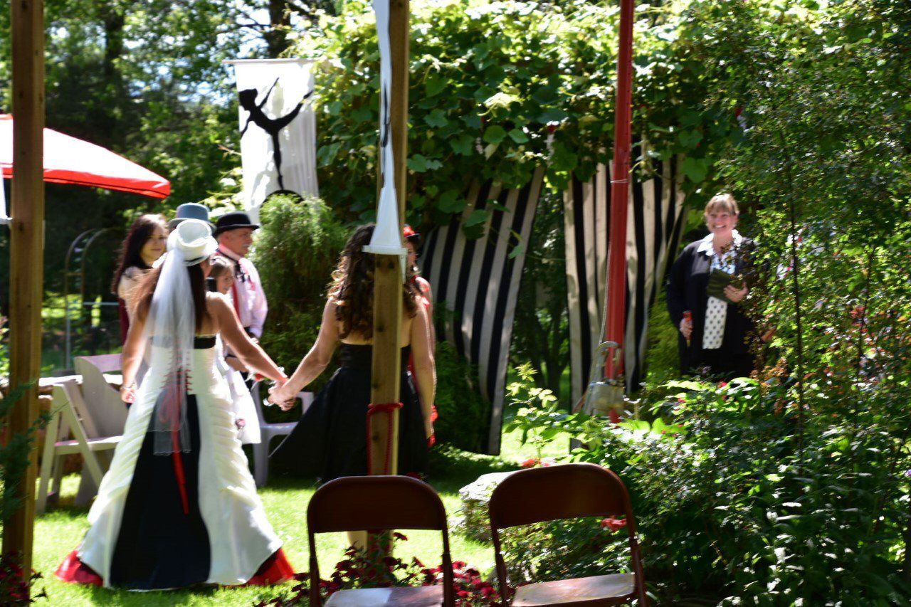 Bride walking down the aisle with her mom at an intimate backyard wedding in Niagara Region