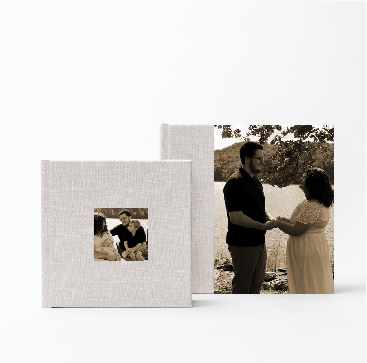 Two linen-covered photo albums featuring family portraits displayed together.