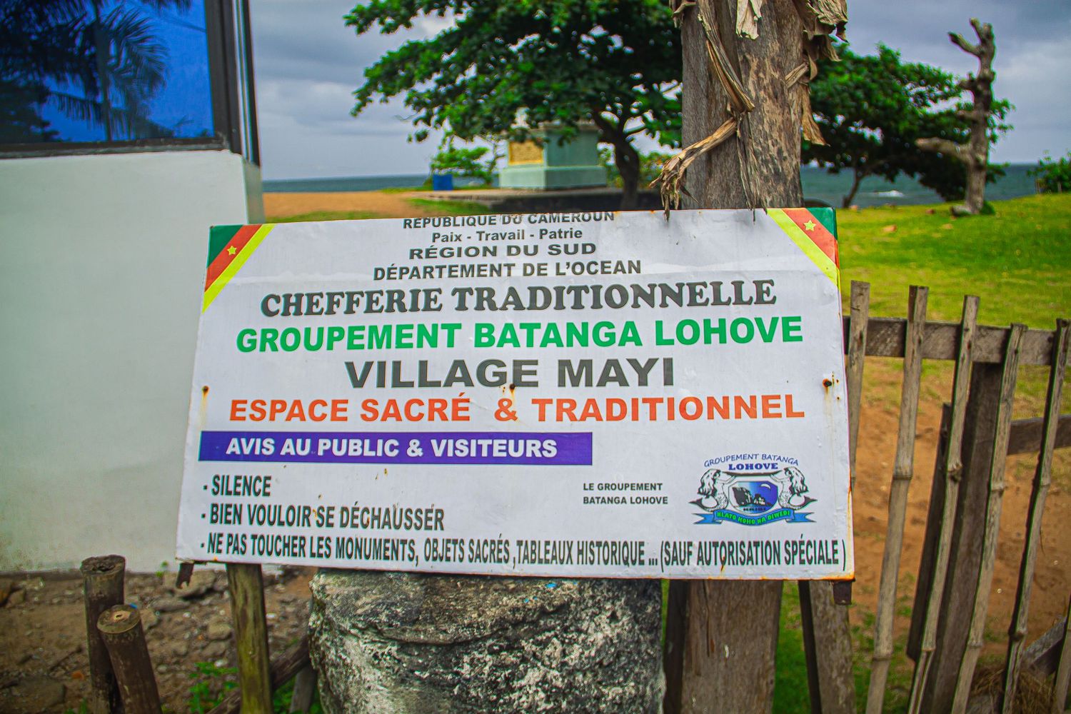 Sign marking the sacred traditional village of Mayi in Cameroon's Batanga Lohove grouping.