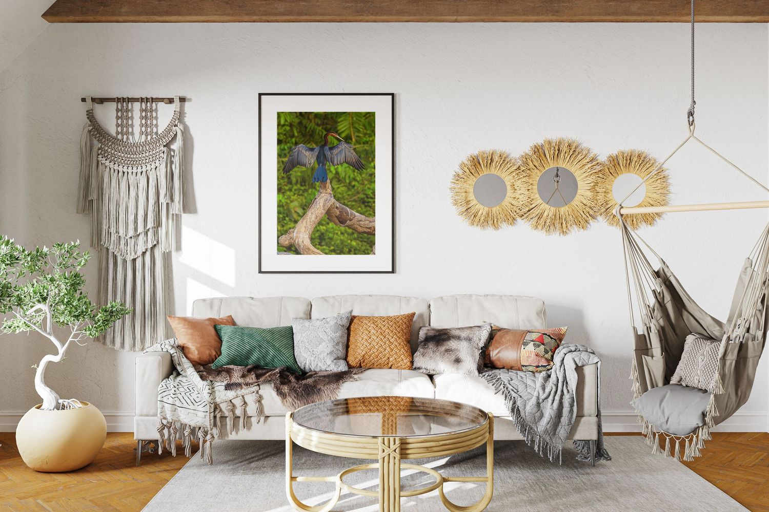 Bohemian living room with macrame wall art, framed aerial forest path print, and hanging chair.
