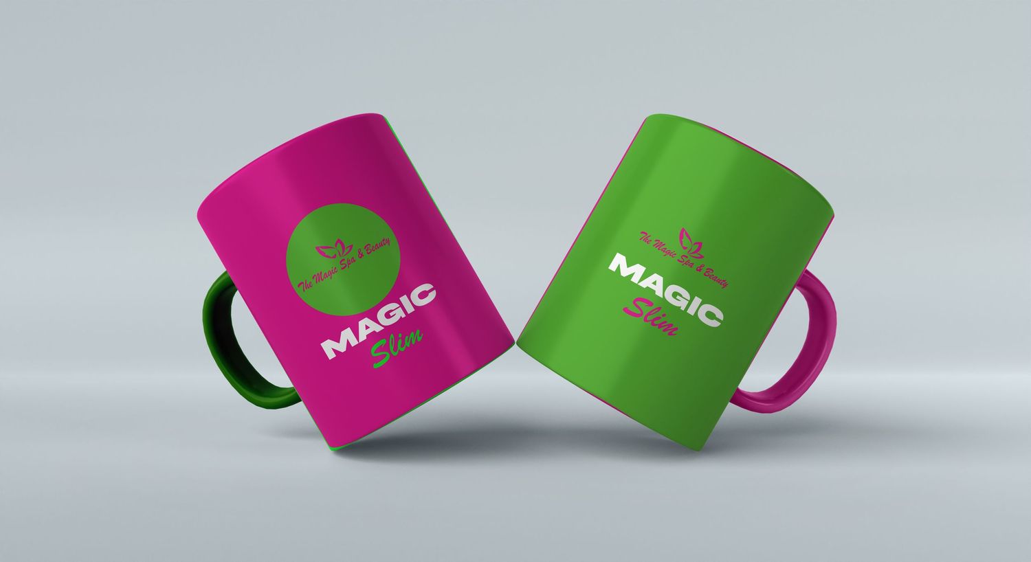 Two Magic Slim branded mugs in pink and green colors facing each other on light gray background.