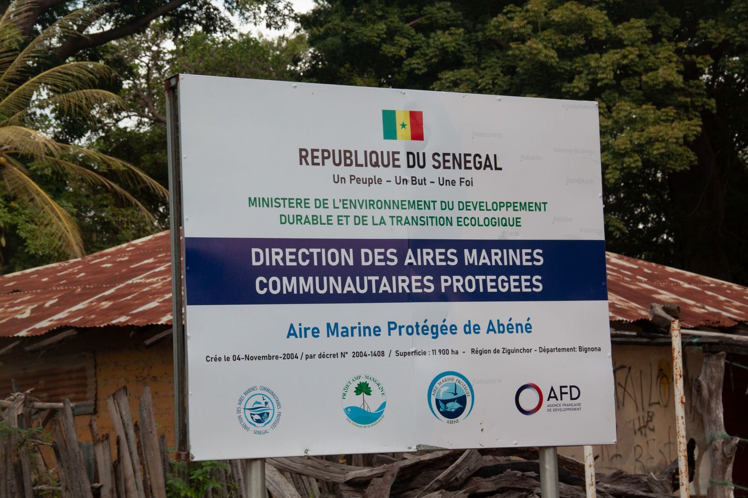 Official sign for Direction des Aires Marines Communautaires Protegees in Senegal funded by AFD.