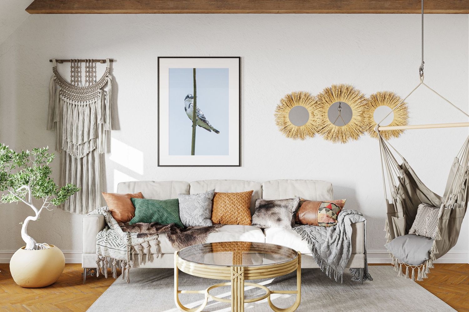 Bohemian living room featuring a framed photograph of a bird perched on a branch above a sofa.