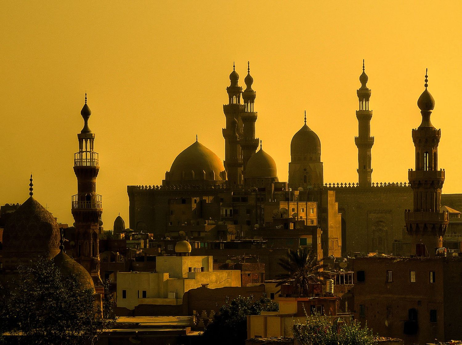 Sultan Hassan Mosque silhouette Cairo Egypt golden dusk sky Islamic architecture fine art travel photography stock print.