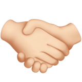 Two hands shaking in a friendly handshake gesture, symbolizing agreement, partnership, and cooperation.