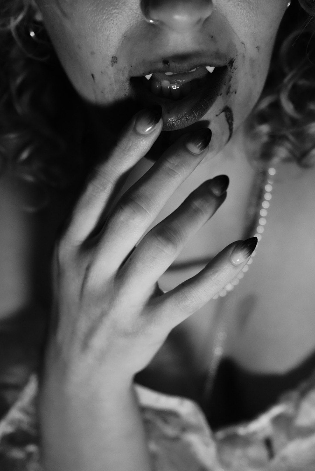 Vampire licking finger