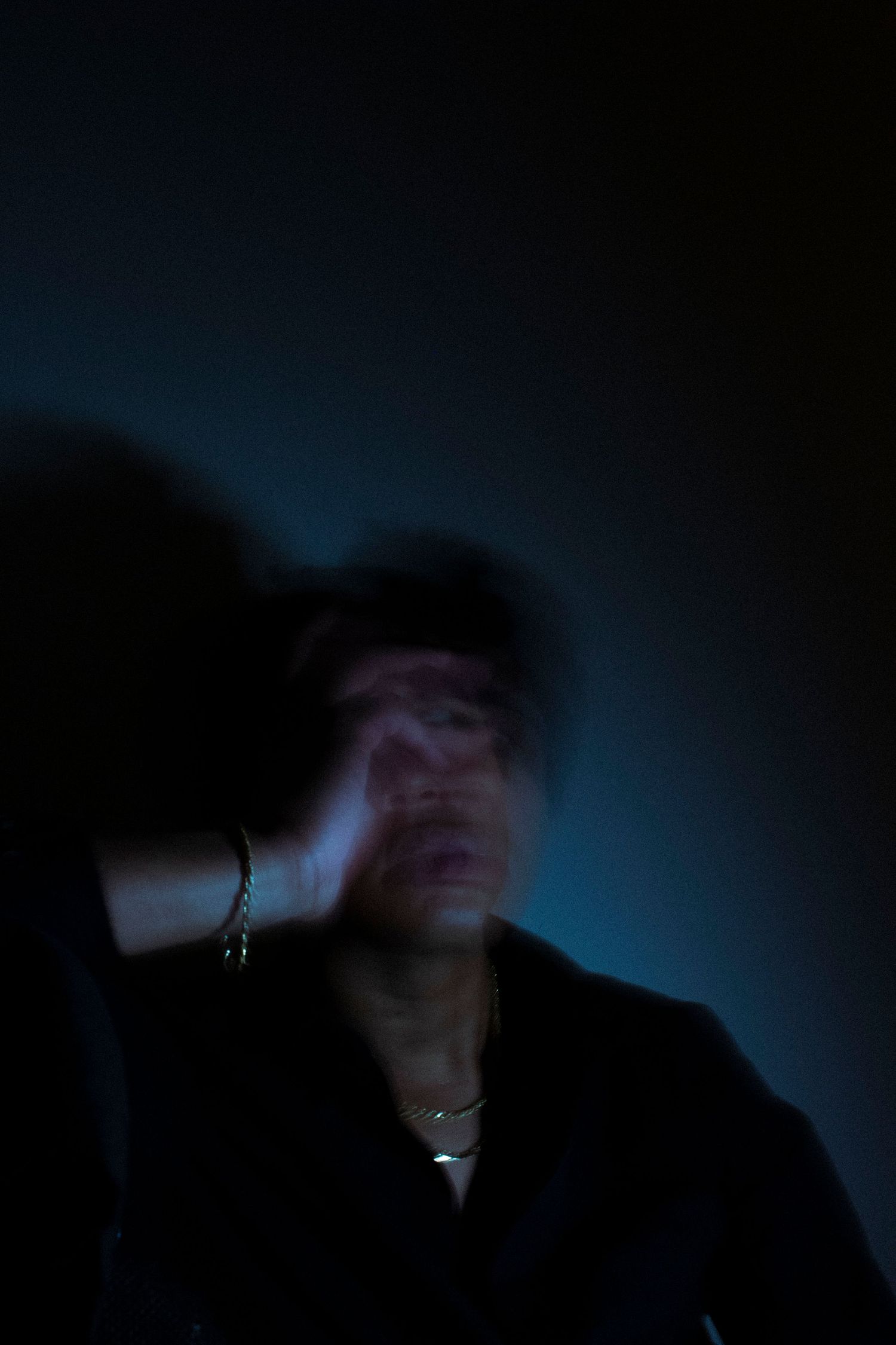 Man covering face