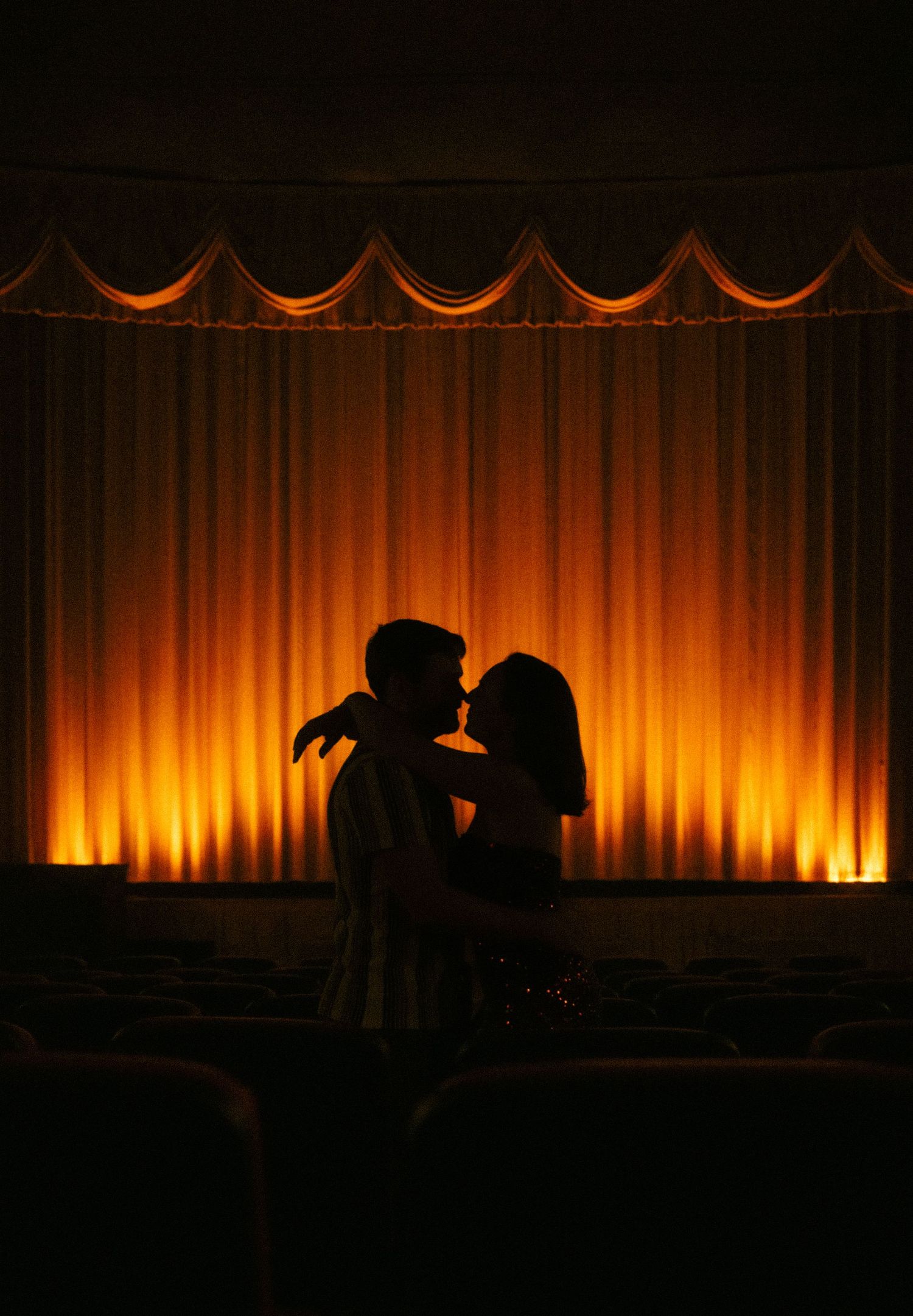 engagement photos at Plaza Theatre Atlanta marquee in the rain