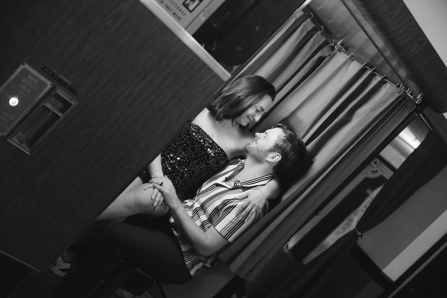 engagement photos at Plaza Theatre Atlanta marquee in the rain