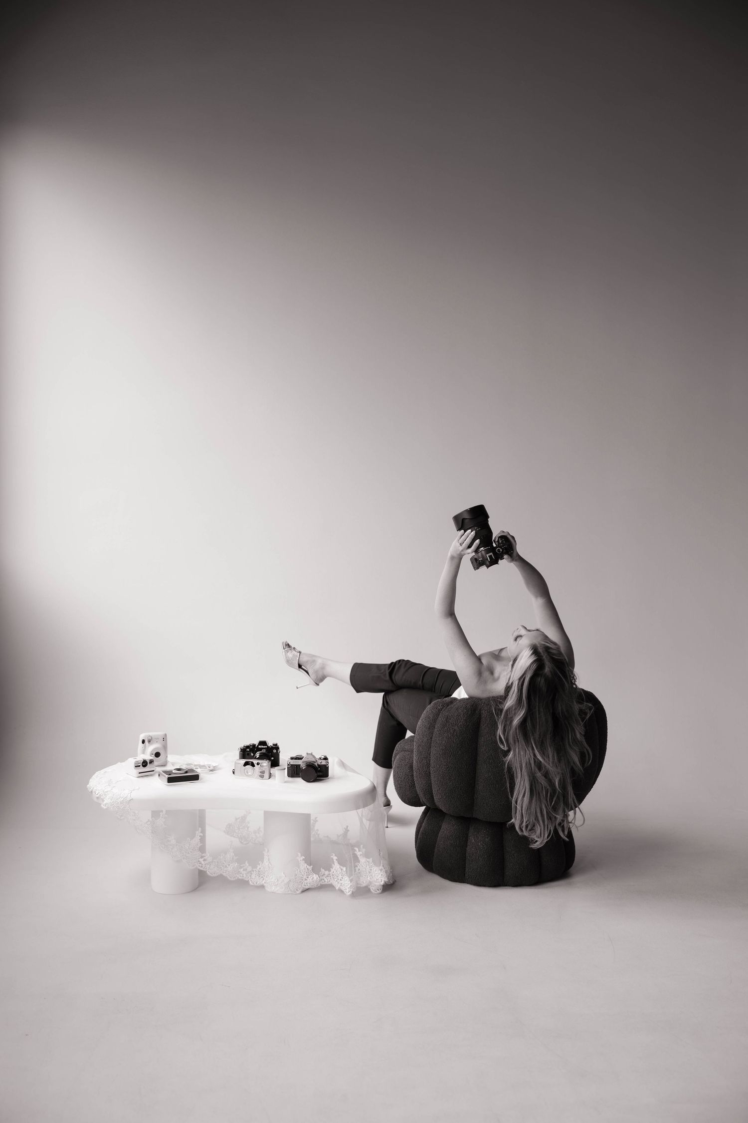 Tampa and SWFL editorial and timeless photographer with cameras during studio branding photoshoot in Tampa, Florida.