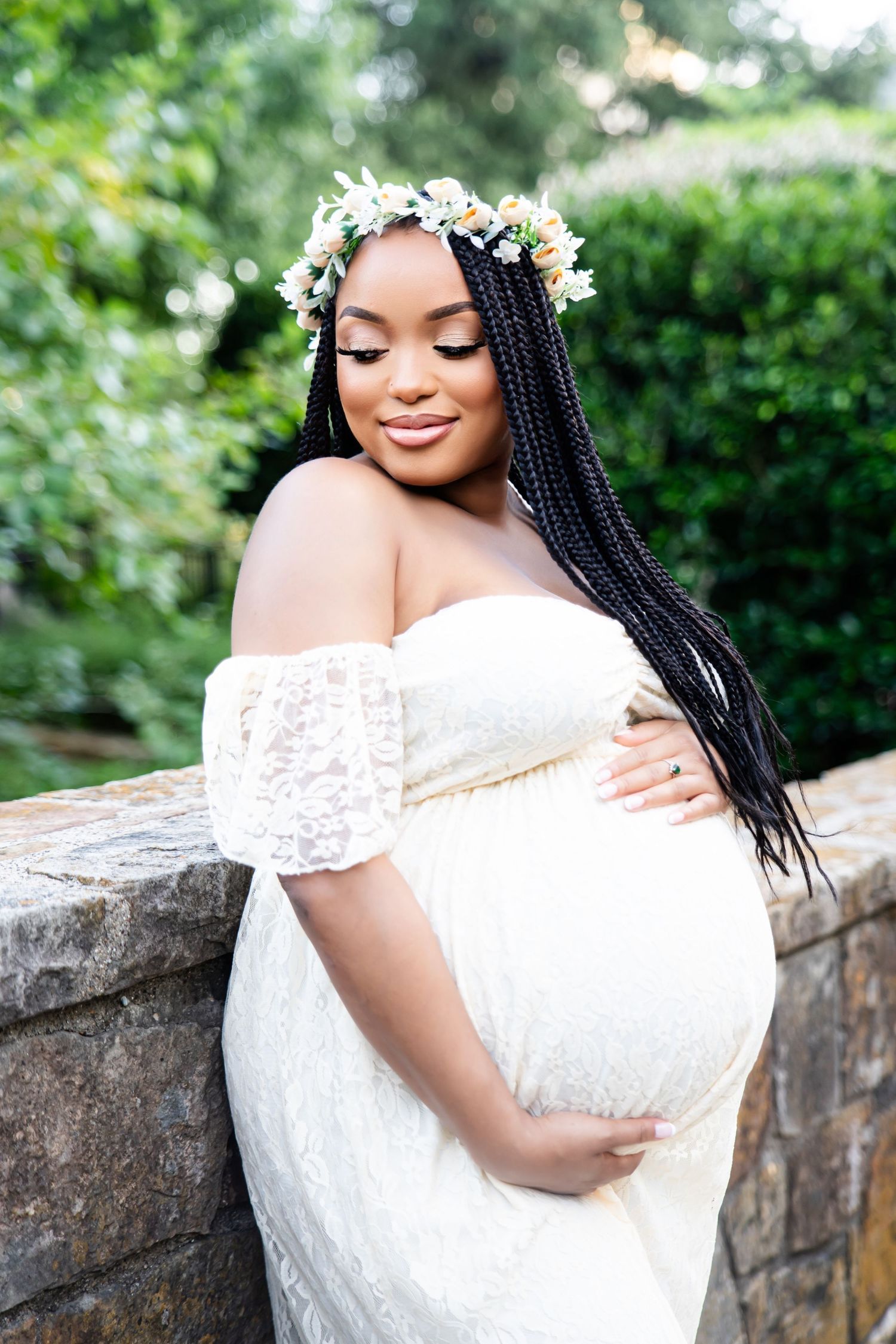 Romantic outdoor portrait session with lace dress and floral crown.