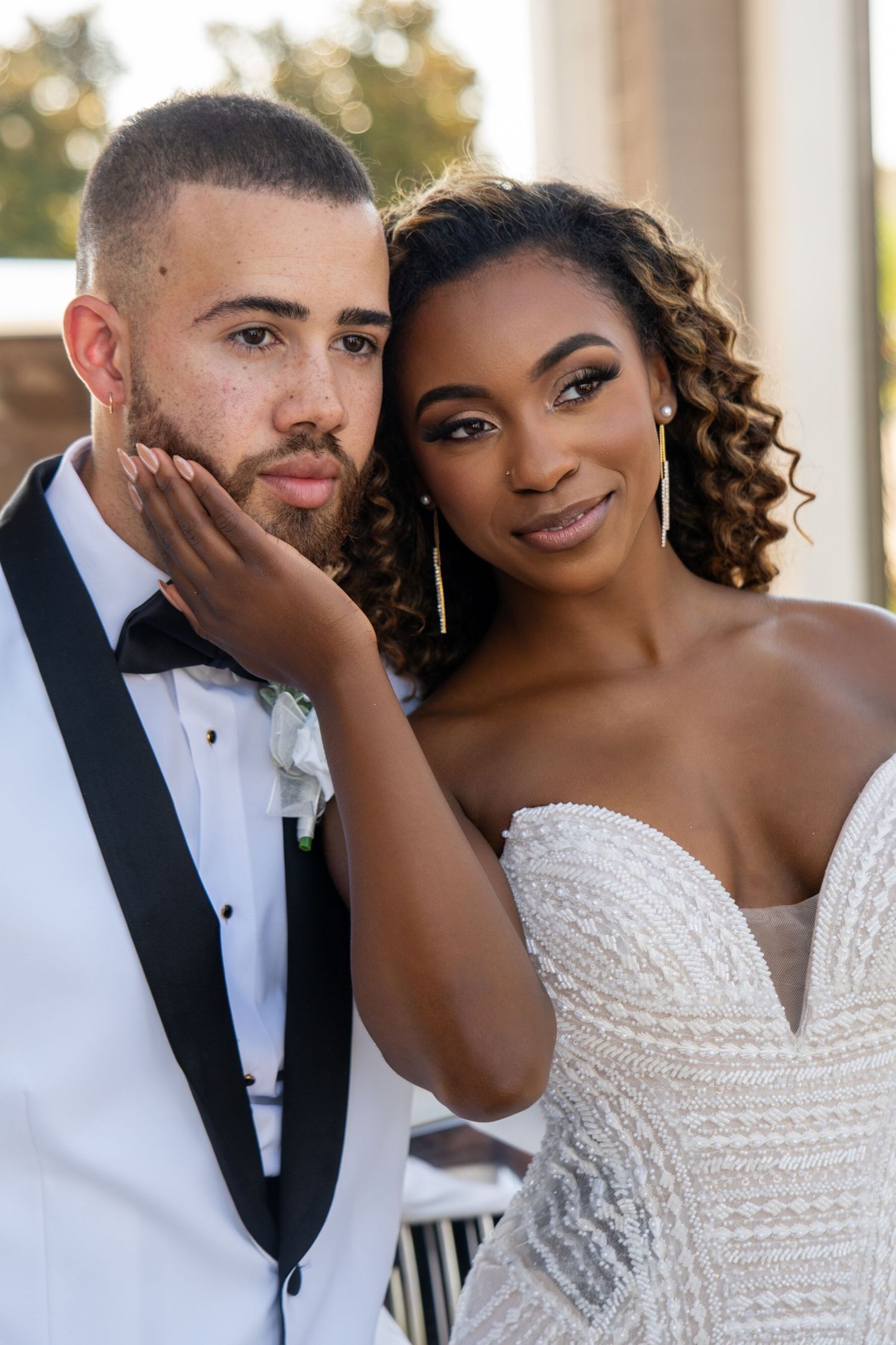 Intimate wedding couple portraits showing tender moments and genuine smiles.