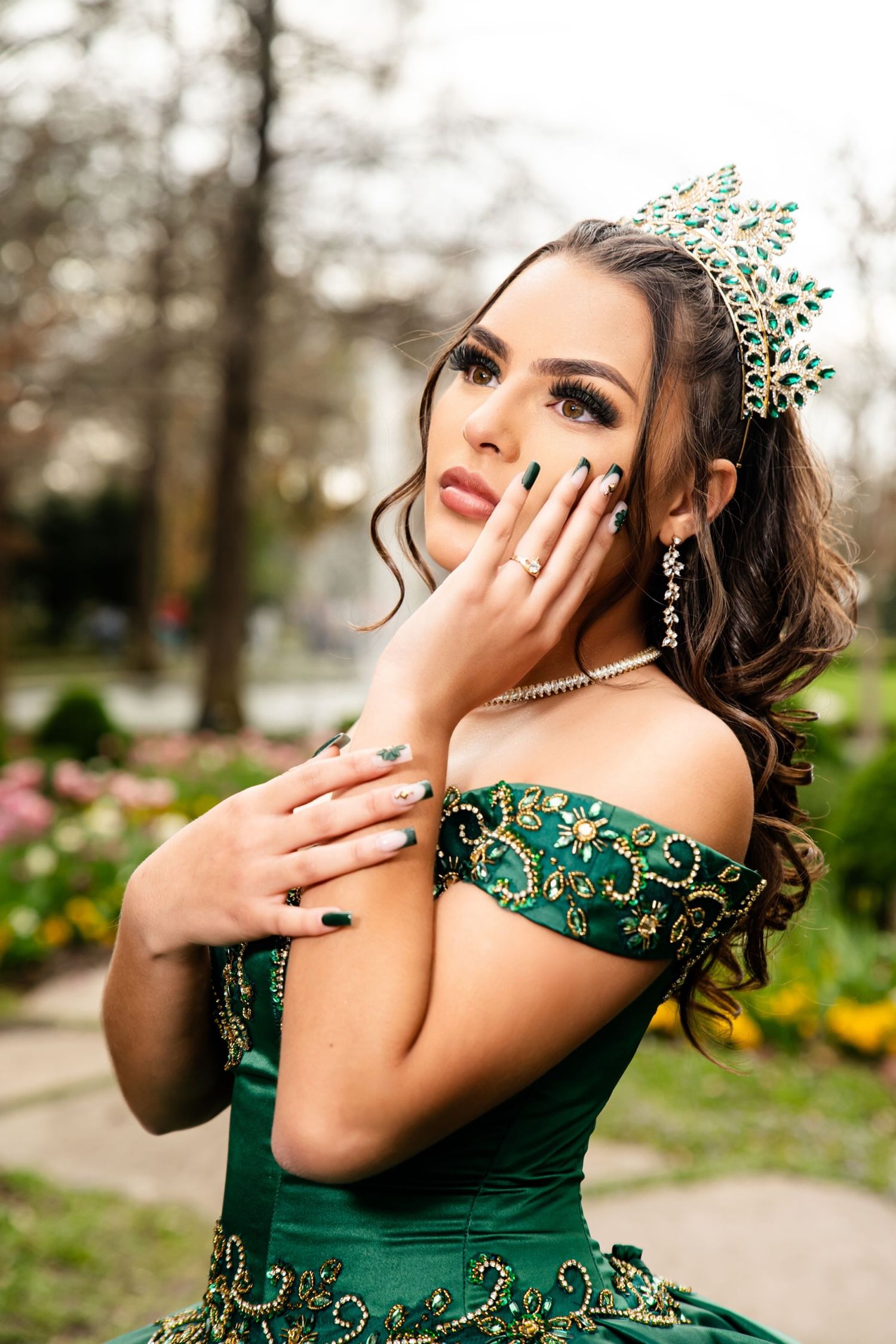 Playful portrait series in an emerald green formal gown with delicate hand poses.