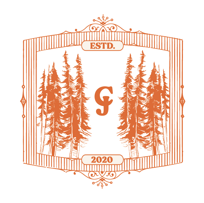 Decorative orange logo design featuring pine trees and established date in an elegant frame.