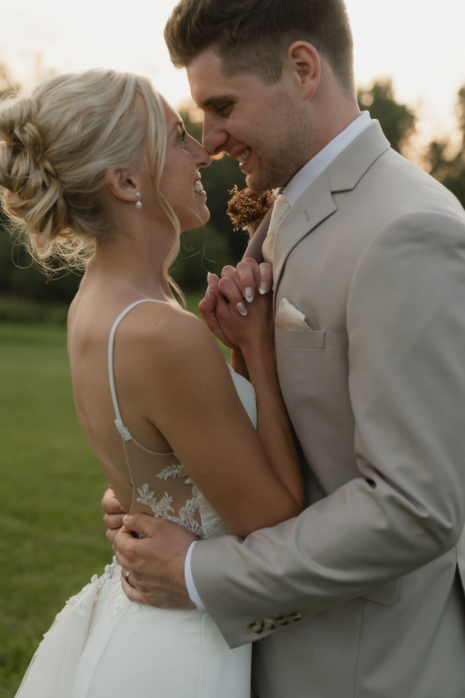A tender moment between newlyweds during golden hour on their wedding day.
