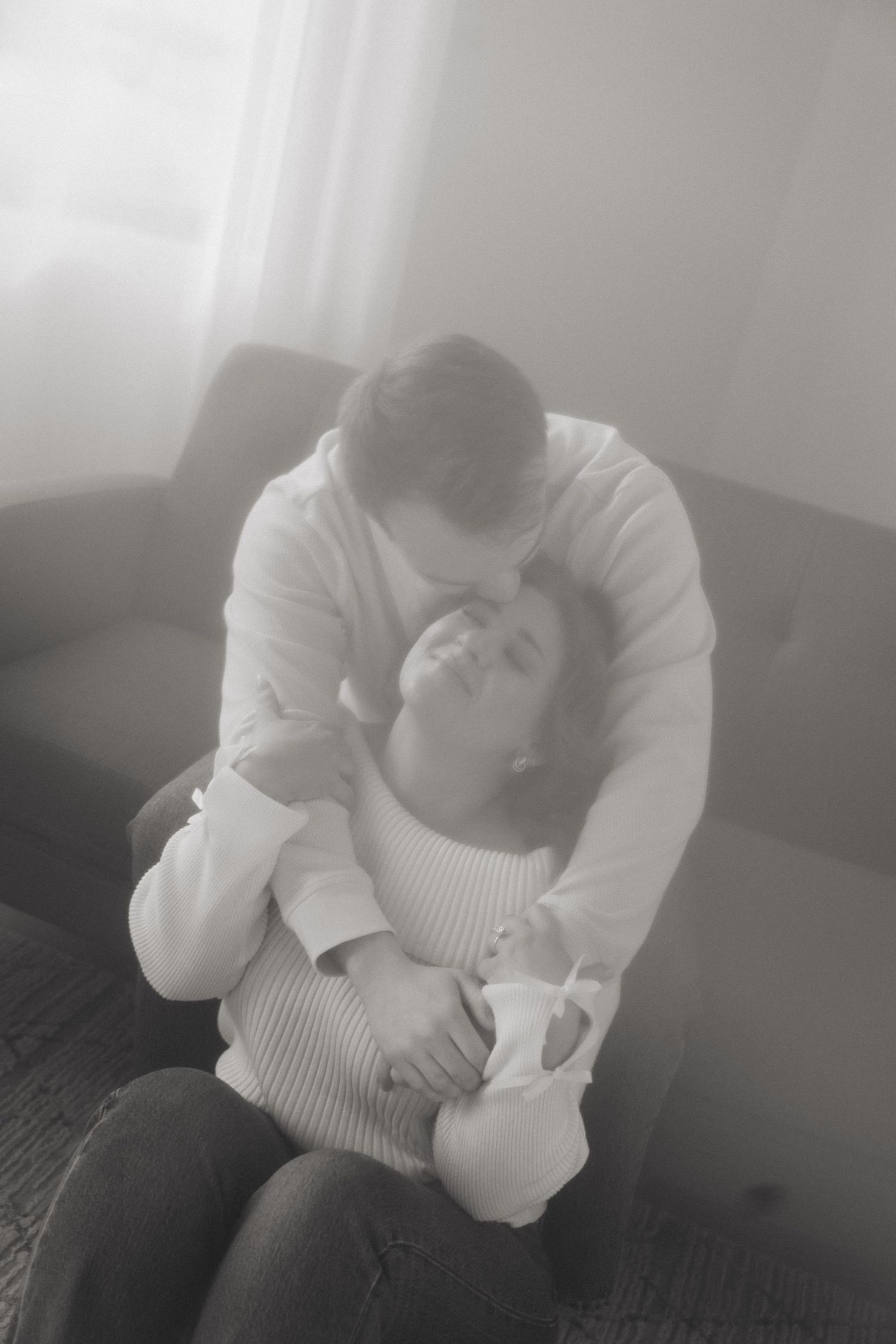 Soft monochrome images capture quiet moments of introspection in a light-filled room.