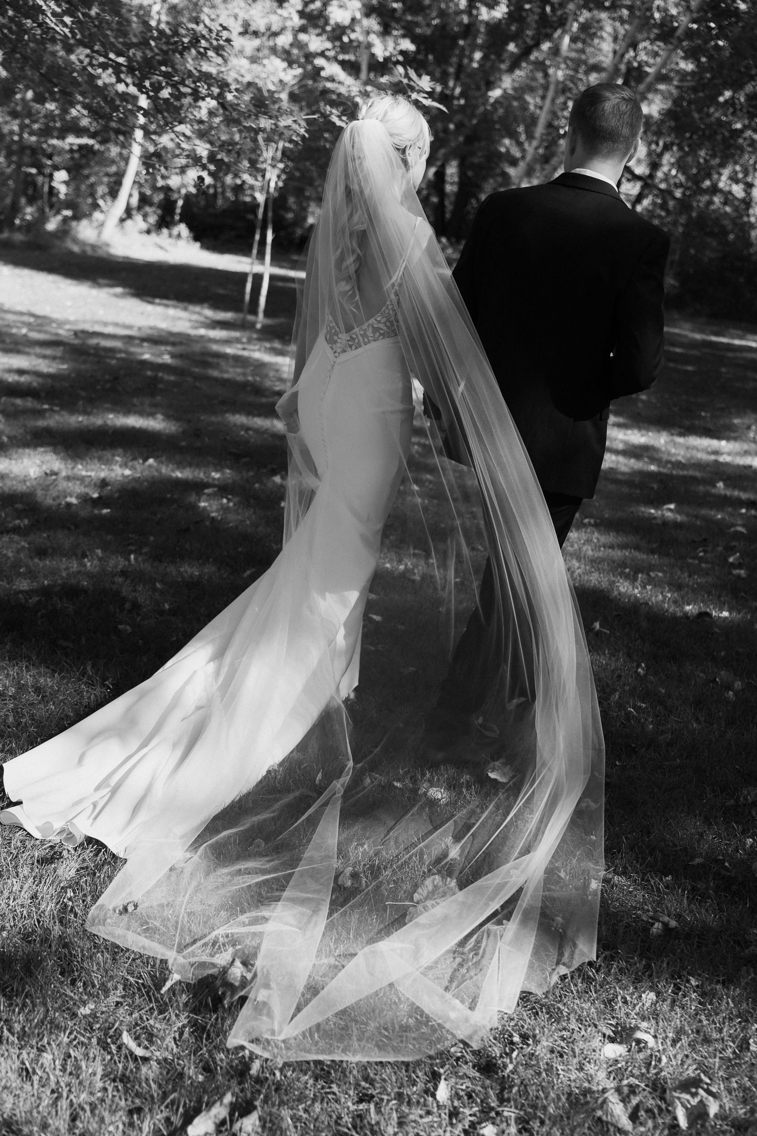 Ethereal black and white photos of a flowing wedding veil moving in the breeze.