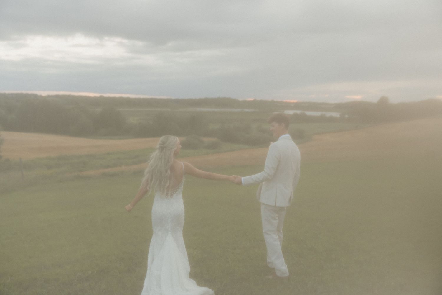 Ethereal silhouettes dance across a misty field during golden hour.