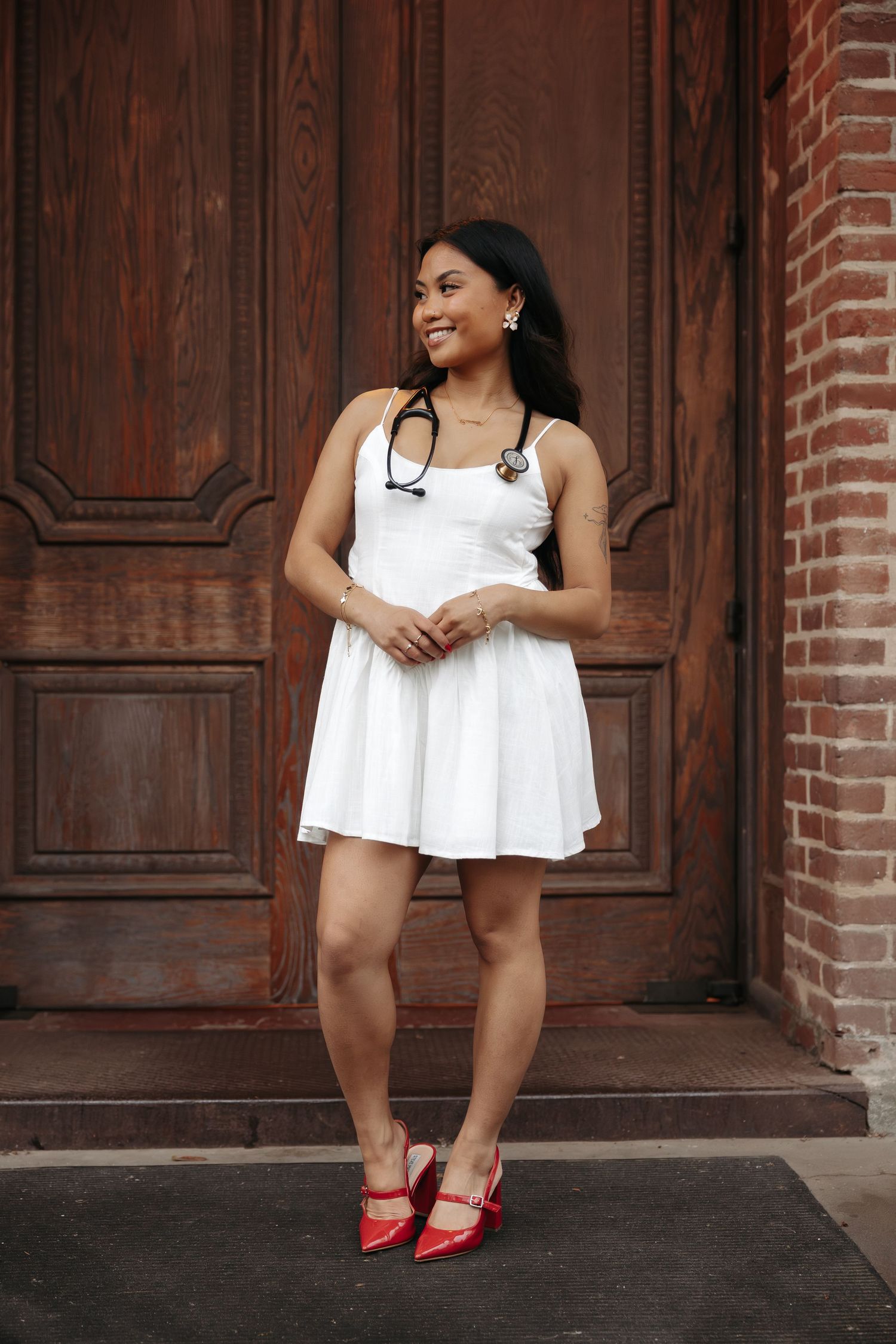 A series of five fashion portraits showing white summer dress and red heels against a rustic wooden door backdrop.